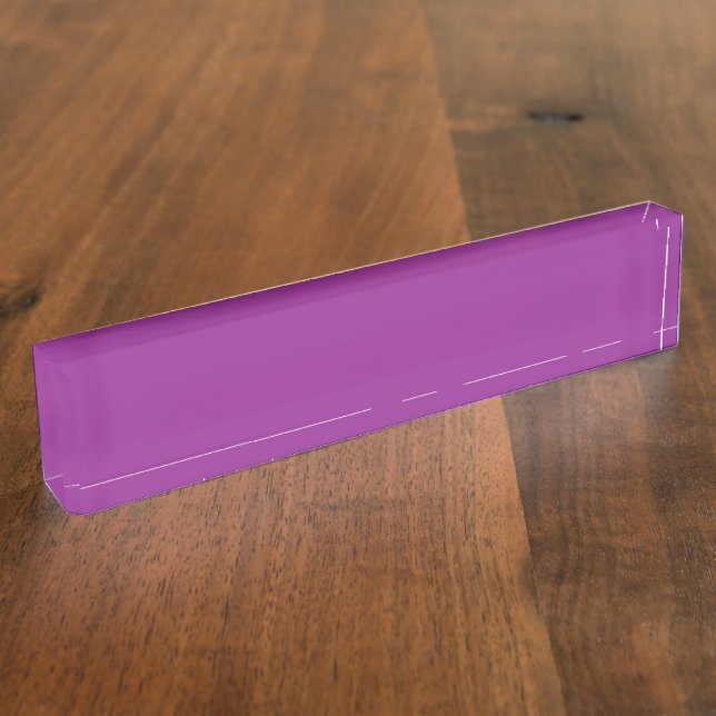 A gradient background blending shades of pink and  desk name plate (Side)