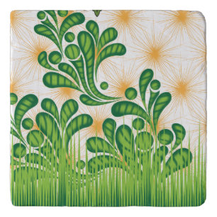 A green and gold artistic pattern depicting a tree trivet