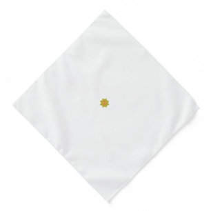 a green and red flower with black dots bandana