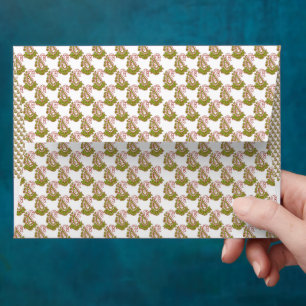 a green and white background with small leaves envelope