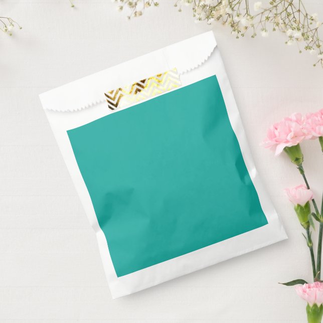 a green background with a  favor bag (Sealed)