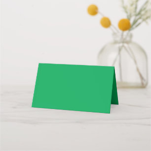 a green background with a place card