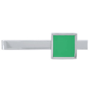 a green background with a silver finish tie bar