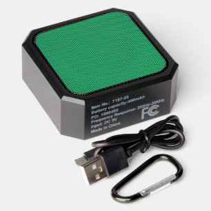 a green background with a white border bluetooth speaker