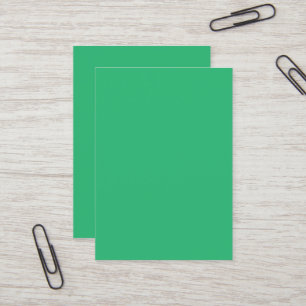 a green background with a white border business card