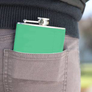 a green background with a white border flask