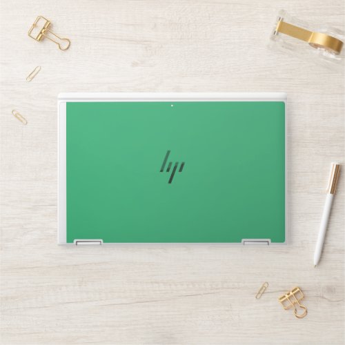 a green background with a white border HP laptop skin