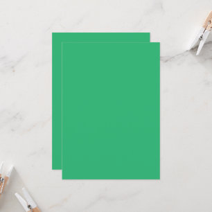 a green background with a white border invitation
