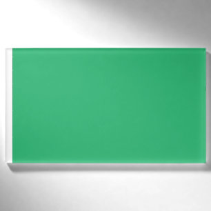 a green background with a white border name tag