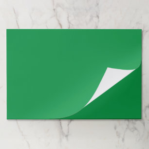 a green background with a white border paper pad