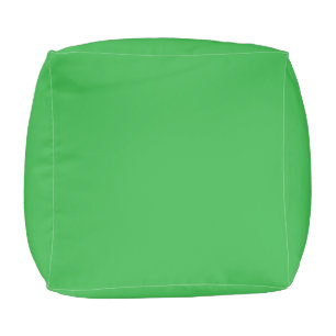 a green background with a white border pouf