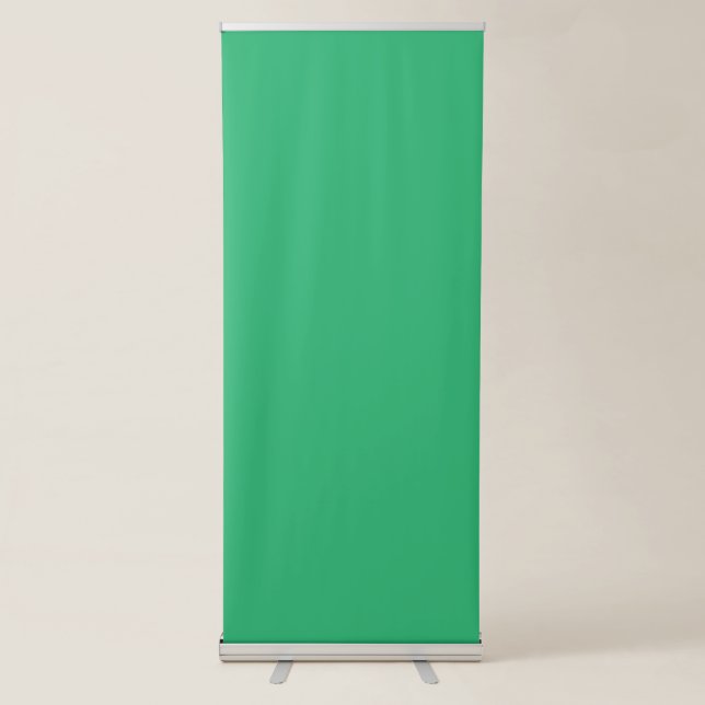 a green background with a white border retractable banner (Front)