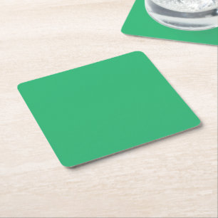 a green background with a white border square paper coaster