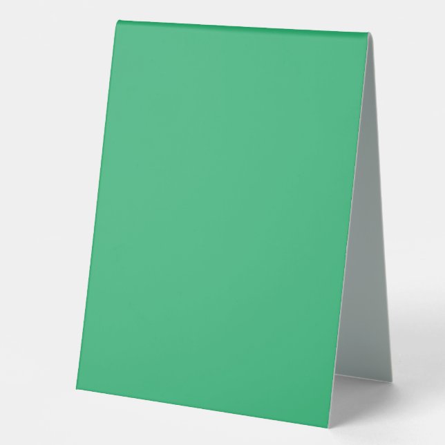 a green background with a white border table tent (Front)
