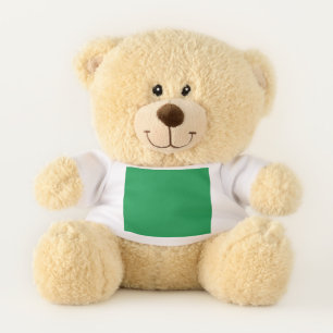 a green background with a white border teddy bear