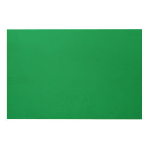 a green background with a wood wall art