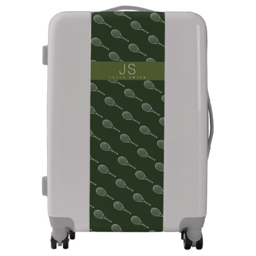 a green pattern of tennis racquets on gray luggage