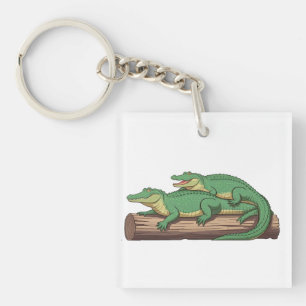 a group of alligators sunning themselves on a log" keychain