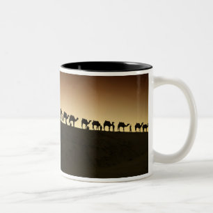 A group of camel herders with their camels Two-Tone coffee mug