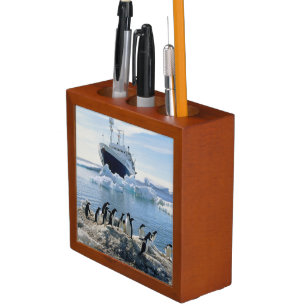 A Group Of Penguins Standing On An Icy Beach Pencil/Pen Holder