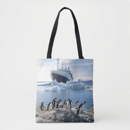 A Group Of Penguins Standing On An Icy Beach Tote Bag