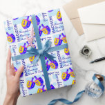 A Hanukkah Dreidels Colorful Pattern Personalized Wrapping Paper<br><div class="desc">This colorful Hanukkah Dreidels pattern wrapping paper is personalized with your name and short message. Easy to customize, this one of a kind Dreidel gift wrap features my original artwork, two spinning tops in vibrant shades of blue, purple, pink and yellow for an unexpected bit of fun. Set on a...</div>