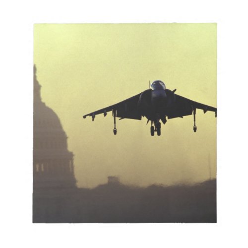 A Harrier jet landing on the Mall at dawn with Notepad