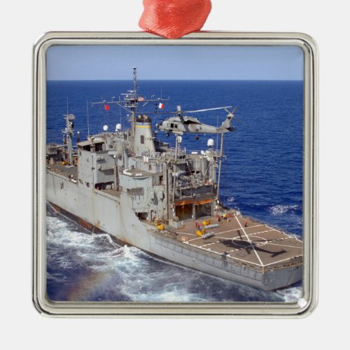 A helicopter clears the flight deck metal ornament