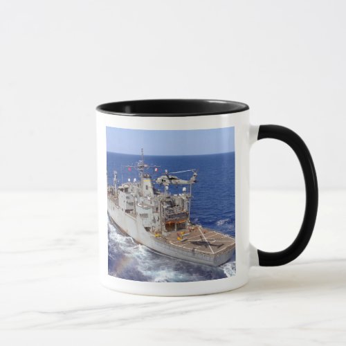 A helicopter clears the flight deck mug