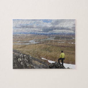 A hiker looks over the Nigu and Etivlik Rivers Jigsaw Puzzle
