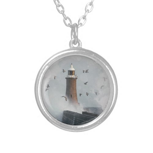 A huge wave hitting a lighthouse compact mirror silver plated necklace