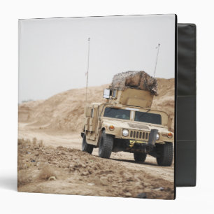 A Humvee conducts security 3 Ring Binder