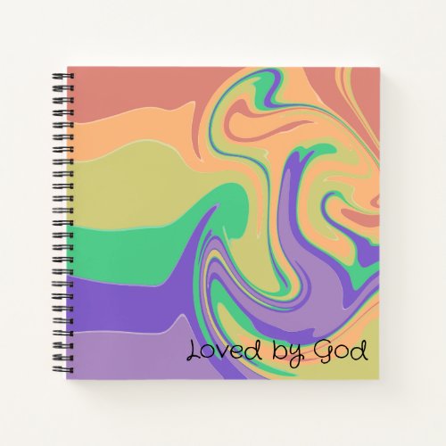 A journal with a swirly rainbow