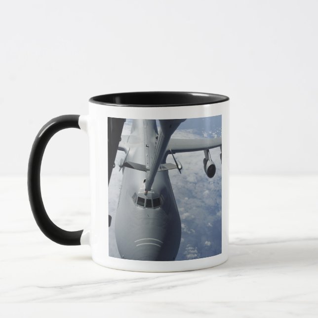 A KC-10 Extender prepares to refuel a C-5 Galax Mug (Left)