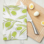 A kitchen towel with a vibrant olive branch print.