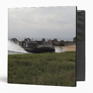 A landing craft air cushion comes ashore binder