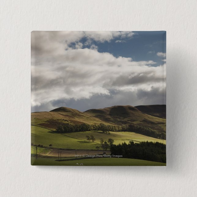 A Landscape With Rolling Hills And Clouds Overhead Pinback Button (Front)