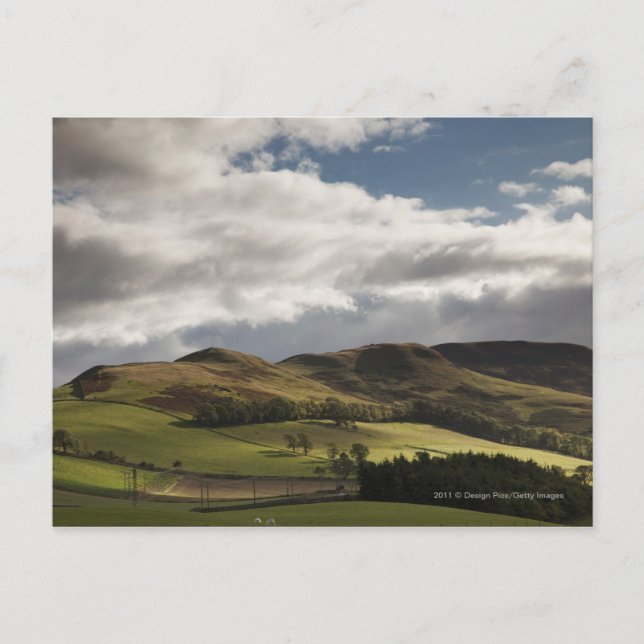 A Landscape With Rolling Hills And Clouds Overhead Postcard (Front)