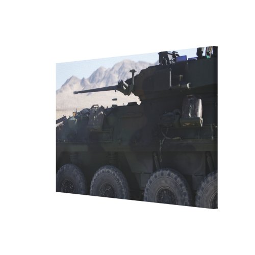 A light armored vehicle fires canvas print