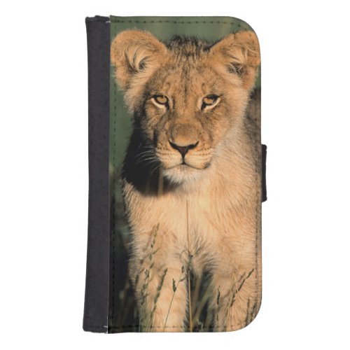 A Lion cub observes the camera from the long grass Galaxy S4 Wallet Case