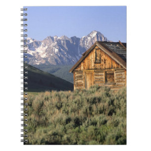 A log cabin and the Sawtooth Mountains in Notebook