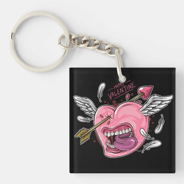 a love heart with lips and wings that are hit by l keychain (Front)