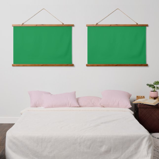 A lush green backdrop with a clean white square po hanging tapestry (Bedroom)