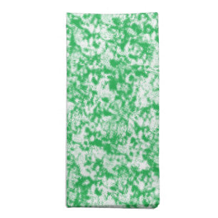 A lush, green fern with delicate, arching fronds f cloth napkin