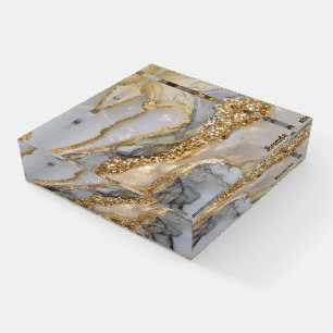 A luxurious gold and white marble background paperweight