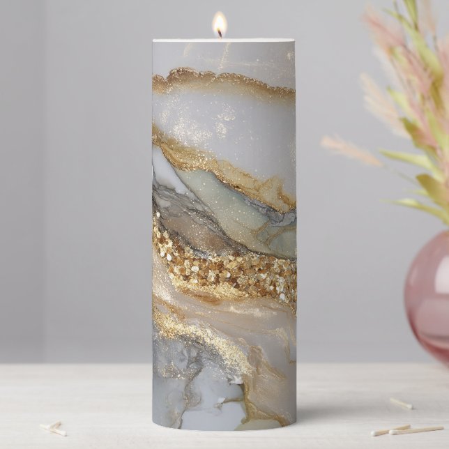 A luxurious gold and white marble background pillar candle (In Situ)