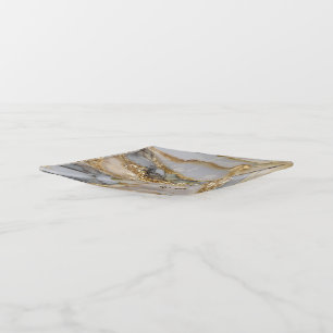 A luxurious gold and white marble background trinket tray