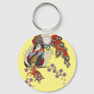 a magical phoenix sitting on a blossom sakura keyc keychain