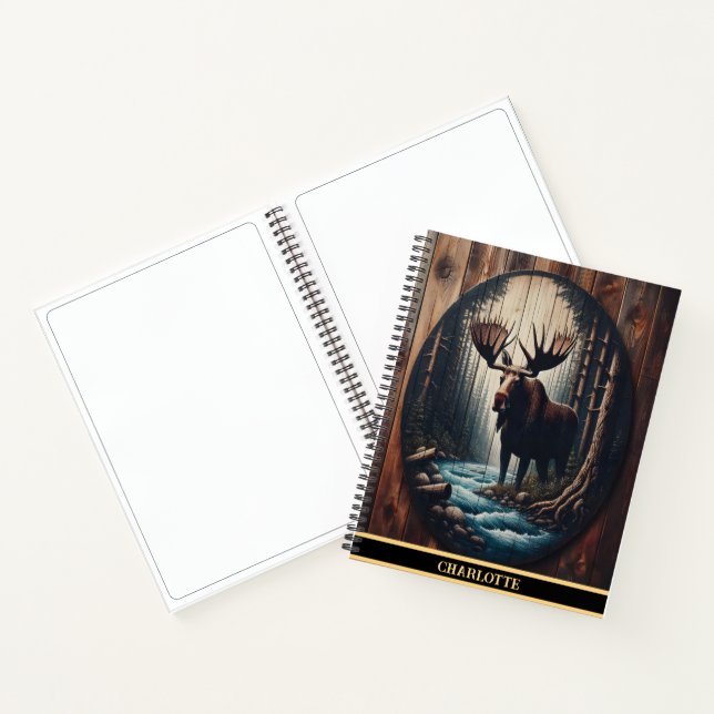 A majestic moose standing by a serene riverbank notebook (Inside)