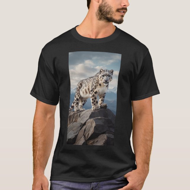 A majestic snow leopard standing on a rocky cliff  T-Shirt (Front)